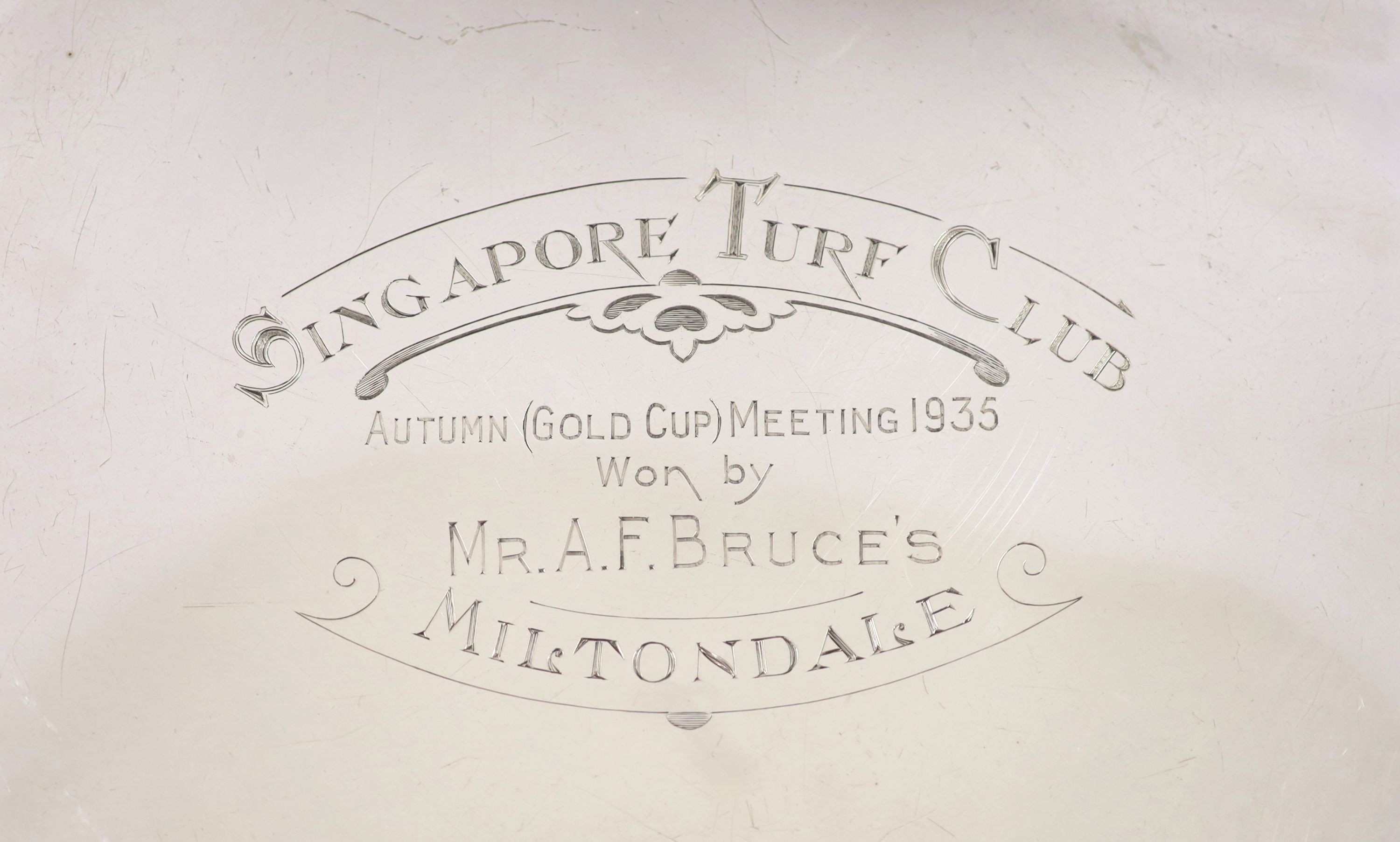 A George V shaped circular salver with '1935 Singapore Turf Club' engraved inscription